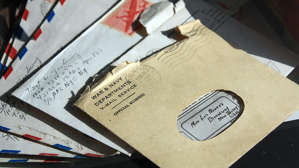 Opened brown envelopes of post, like a tax code notice arriving in the mail