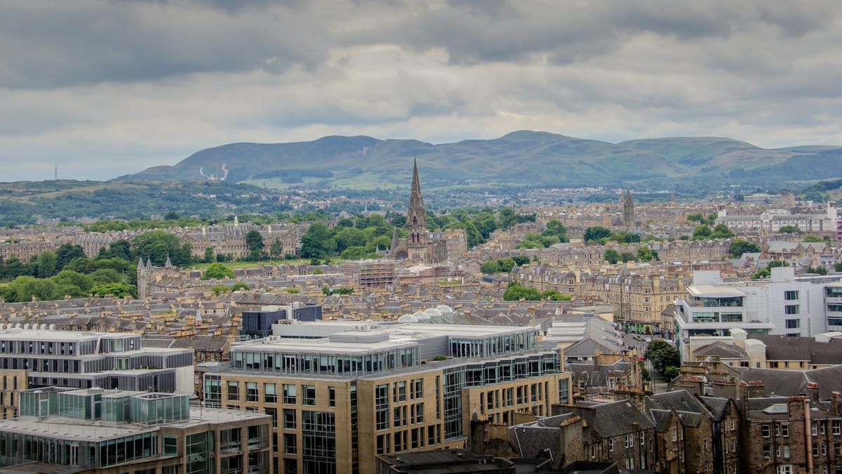 The Edinburgh skyline in Scotland under a cloudy sky